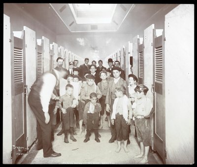 Interior View of Young Men Posed in the Bathing Stall Area at the People